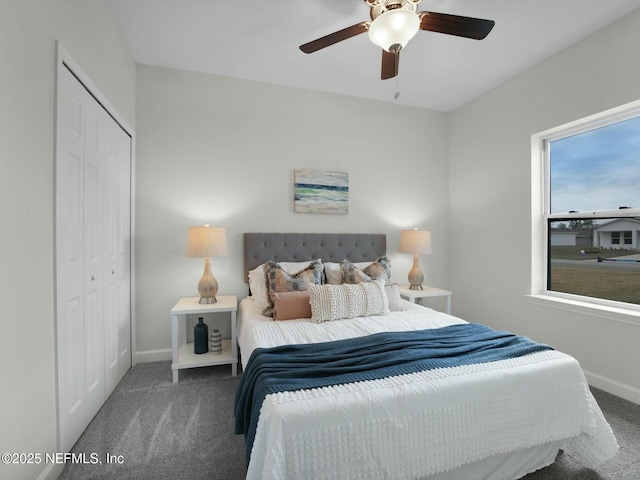 carpeted bedroom with ceiling fan and a closet