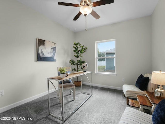 carpeted office featuring ceiling fan