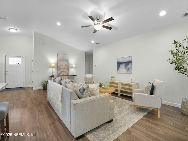 living room with vaulted ceiling, ceiling fan, and hardwood / wood-style floors