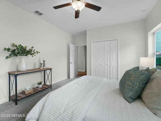 carpeted bedroom with a closet and ceiling fan