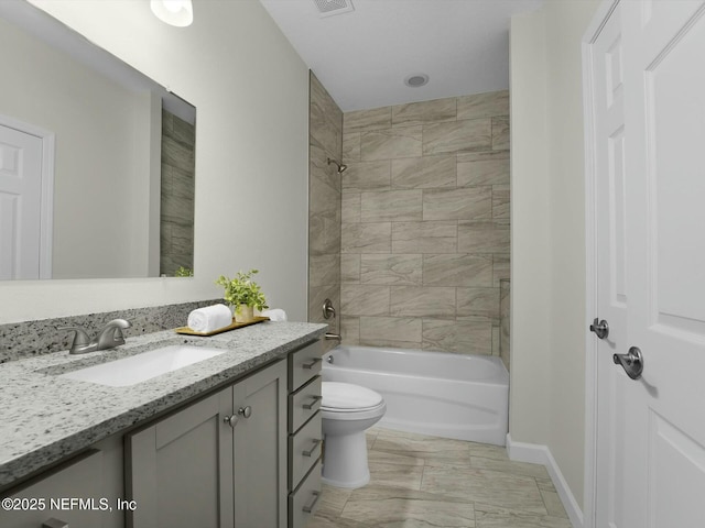 full bathroom featuring toilet, tiled shower / bath combo, and vanity