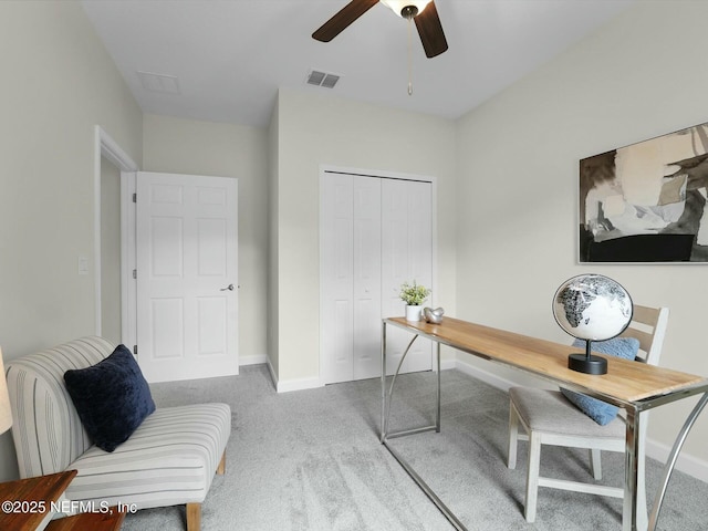 office featuring ceiling fan and light colored carpet