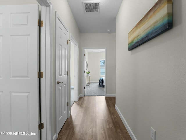 hall featuring dark wood-type flooring