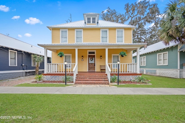 view of front of home featuring a front lawn and a porch