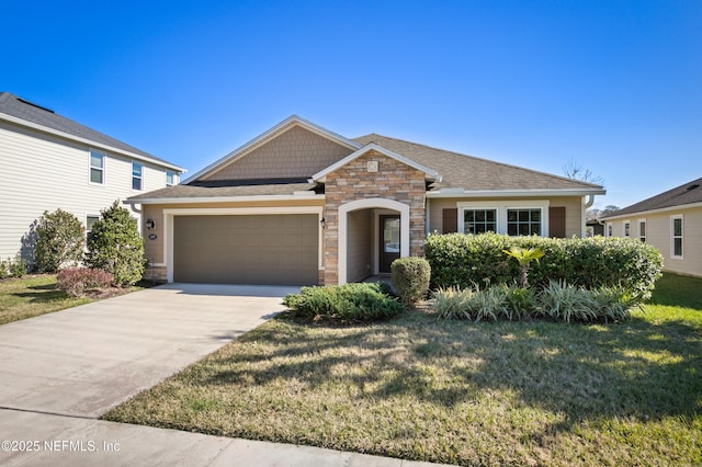 view of front of home with a garage and a front yard