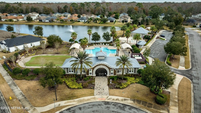 birds eye view of property featuring a water view