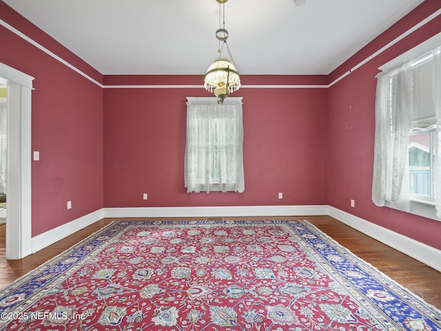 spare room with hardwood / wood-style flooring