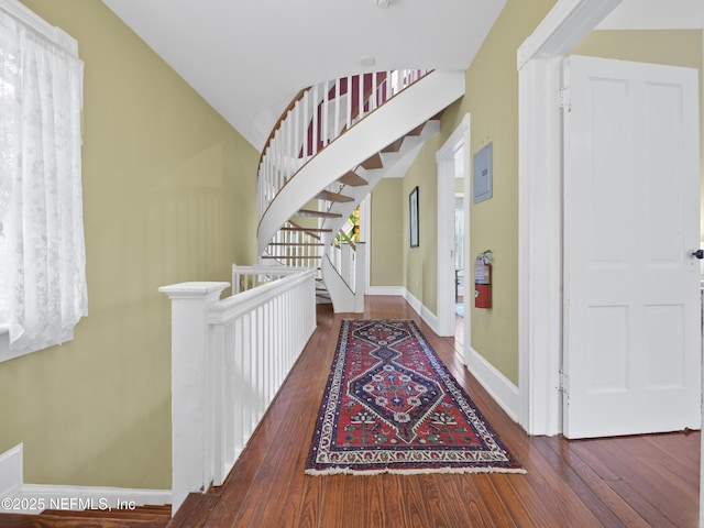 entryway featuring vaulted ceiling and hardwood / wood-style flooring