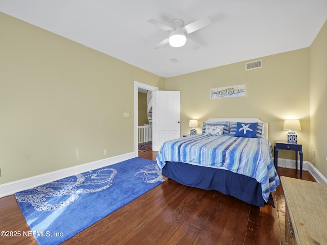 bedroom featuring ceiling fan and dark hardwood / wood-style floors