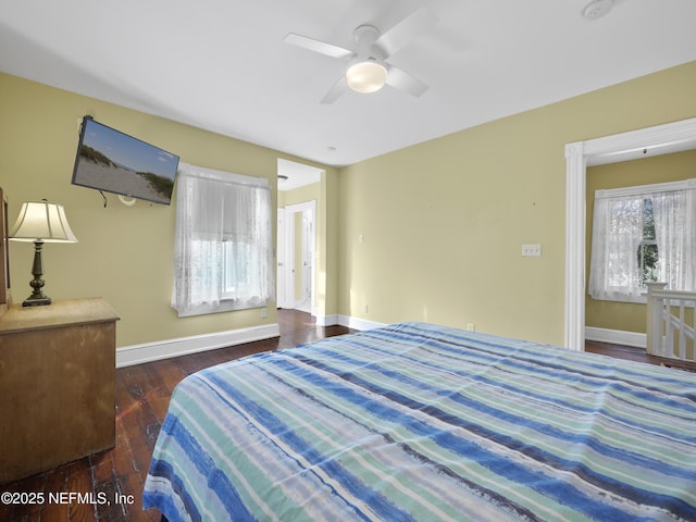 bedroom featuring ceiling fan and dark hardwood / wood-style flooring