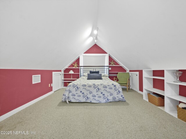 bedroom with carpet and vaulted ceiling