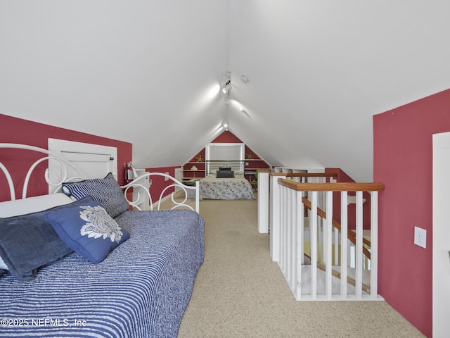 bedroom with carpet and lofted ceiling