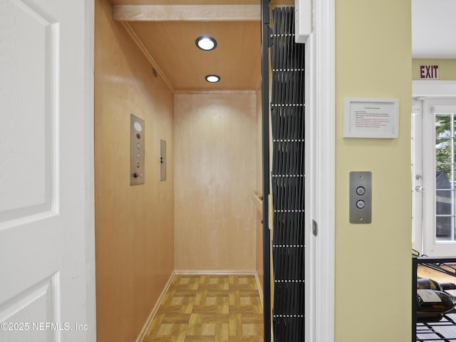 interior space featuring light parquet floors and elevator