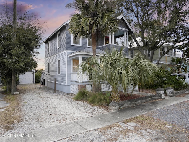 view of front facade with a garage and an outdoor structure