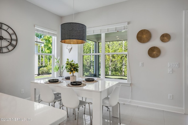 dining area featuring light tile patterned floors