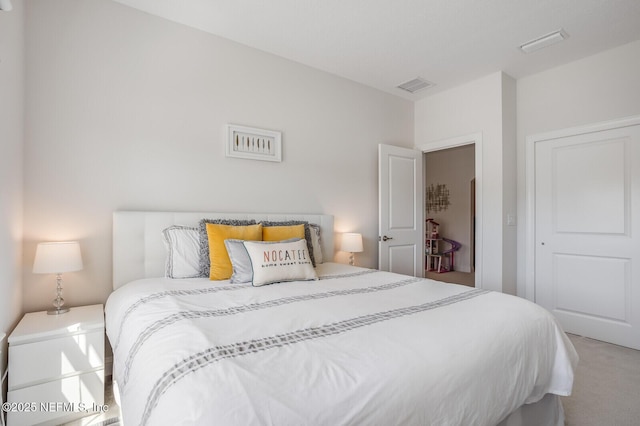 carpeted bedroom with a closet