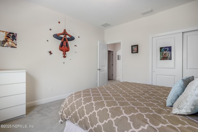 carpeted bedroom featuring a closet