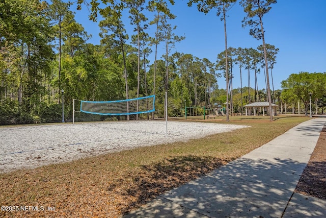 view of property's community with a gazebo, a yard, and volleyball court