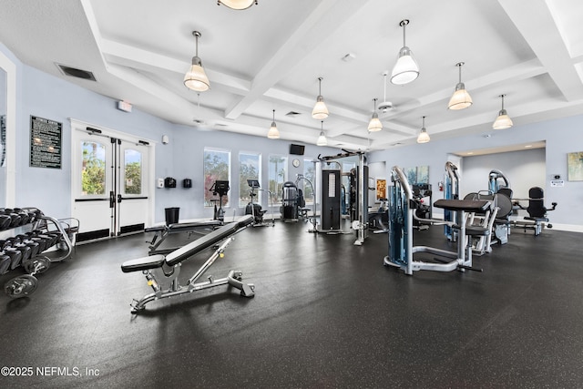 workout area featuring coffered ceiling