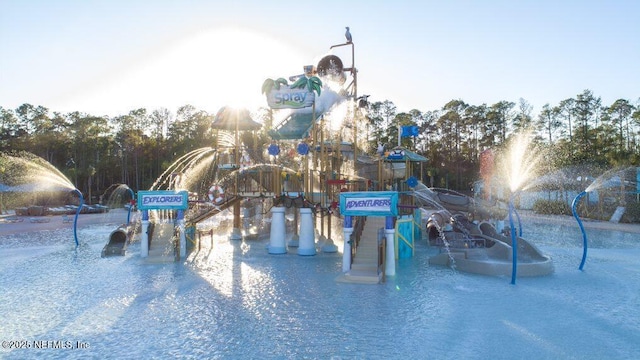 view of pool featuring a playground