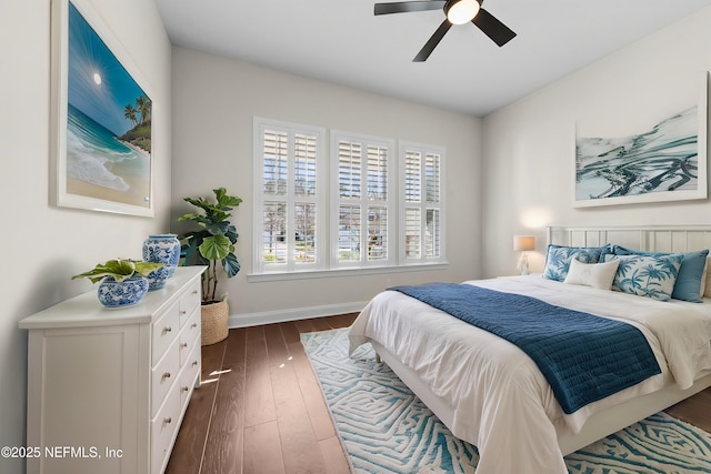 bedroom featuring dark hardwood / wood-style floors and ceiling fan