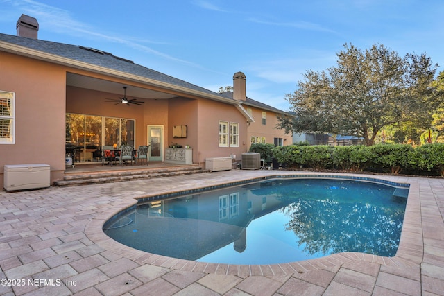 view of pool featuring a patio area, ceiling fan, and central AC unit