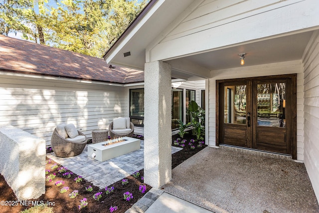 property entrance with french doors and a patio area