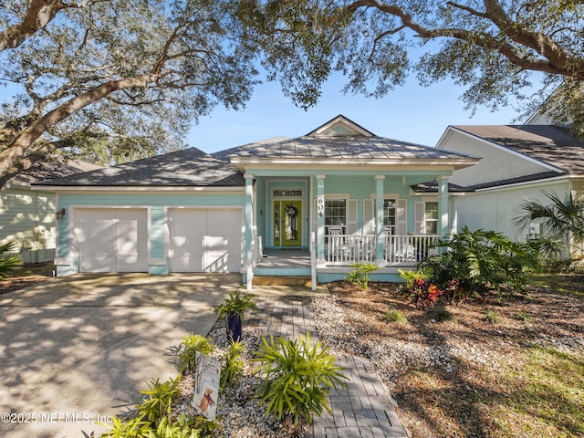 view of front of property featuring a garage and a porch