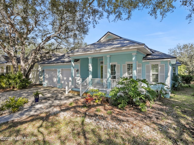 view of front of house featuring a porch and a garage