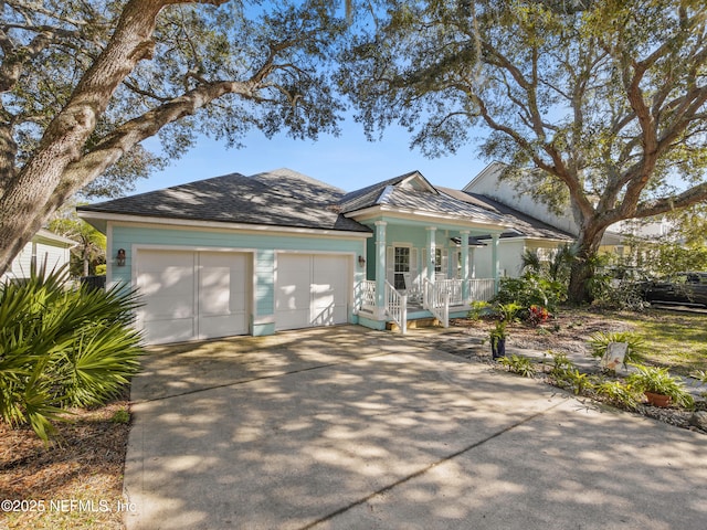 ranch-style house with a garage and a porch