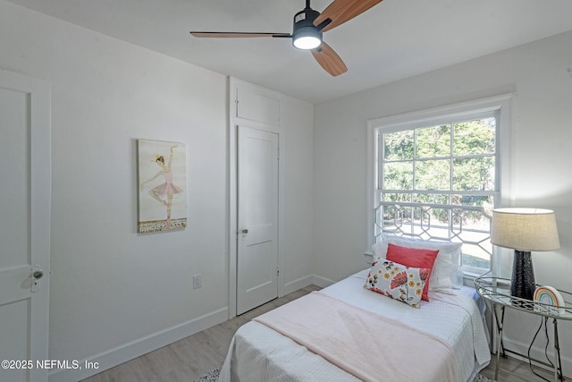 bedroom featuring ceiling fan and wood-type flooring