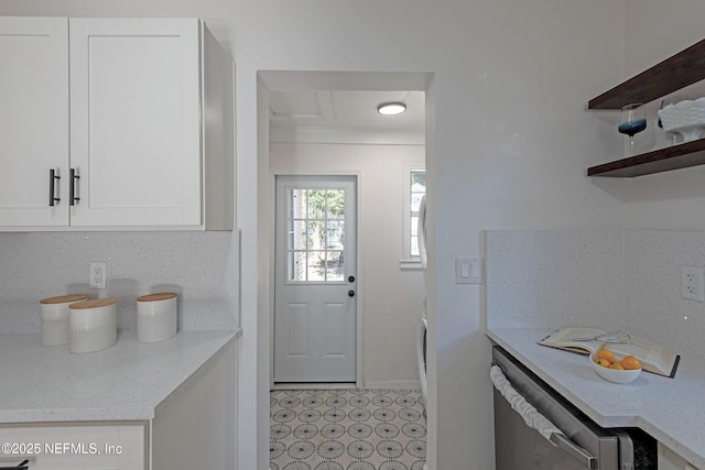 kitchen with white cabinets and light stone countertops