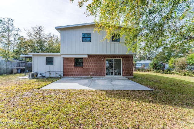 back of house with a patio area, ac unit, and a yard