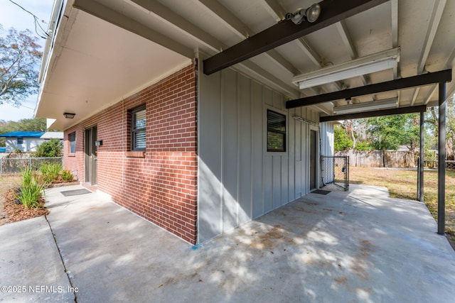 view of property exterior with a patio