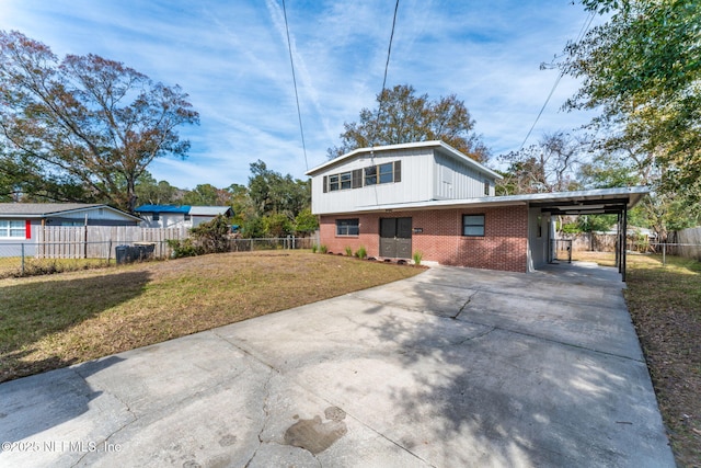 exterior space with a carport and a yard