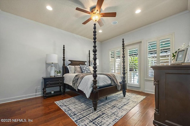 bedroom with ornamental molding, ceiling fan, a textured ceiling, and dark hardwood / wood-style flooring