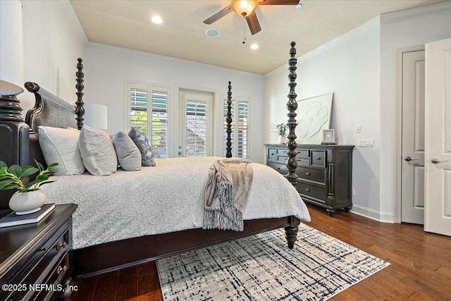 bedroom featuring ornamental molding, dark hardwood / wood-style floors, a textured ceiling, and ceiling fan