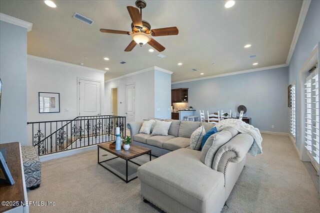 carpeted living room with crown molding