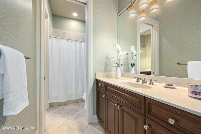 bathroom featuring vanity, curtained shower, tile patterned floors, and toilet