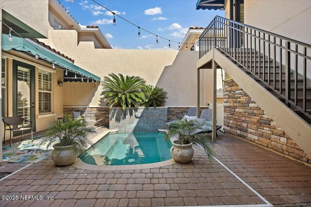 view of pool featuring a patio