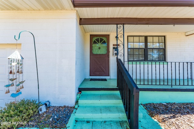 doorway to property featuring covered porch