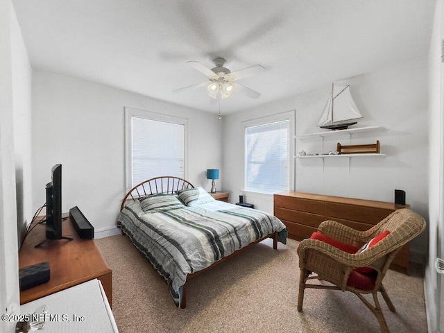 bedroom featuring ceiling fan and carpet flooring