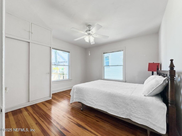 bedroom featuring hardwood / wood-style flooring and ceiling fan