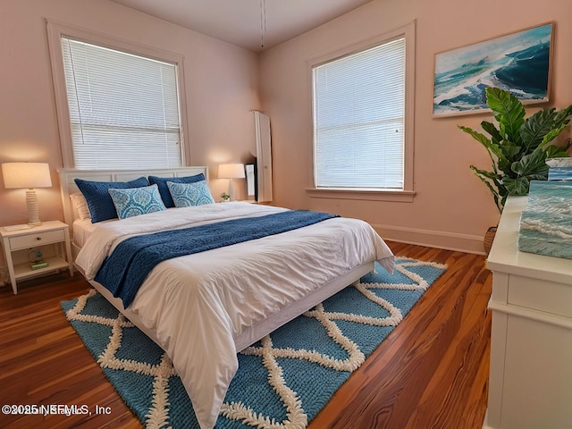 bedroom featuring dark wood-type flooring