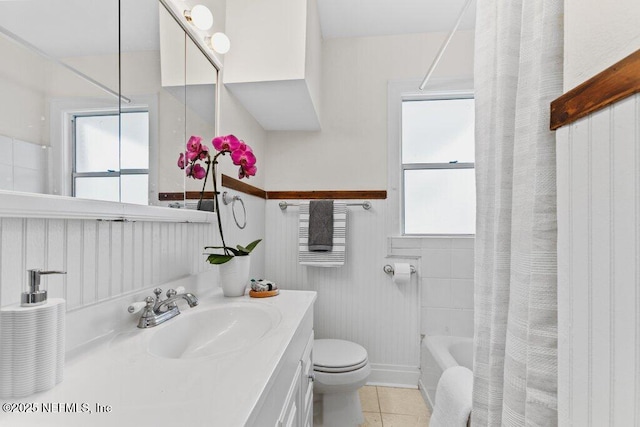 bathroom featuring toilet, vanity, and tile patterned floors