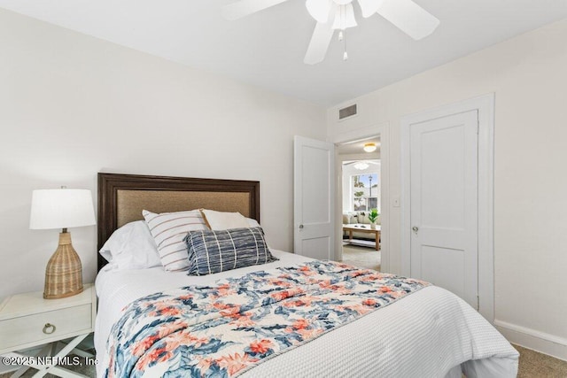 bedroom featuring carpet, visible vents, ceiling fan, and baseboards