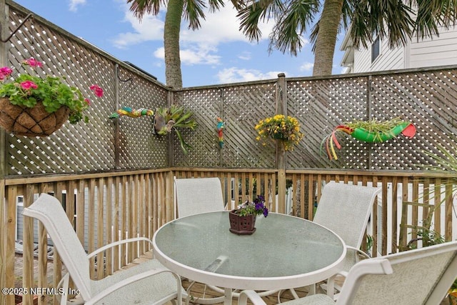 deck with outdoor dining space