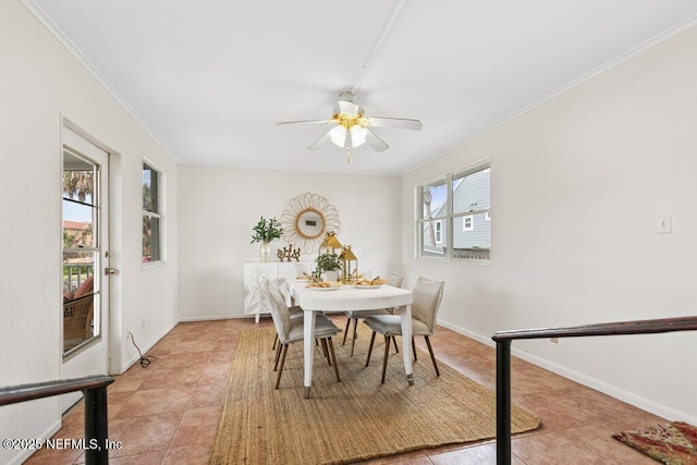 dining space with light tile patterned floors, crown molding, baseboards, and ceiling fan