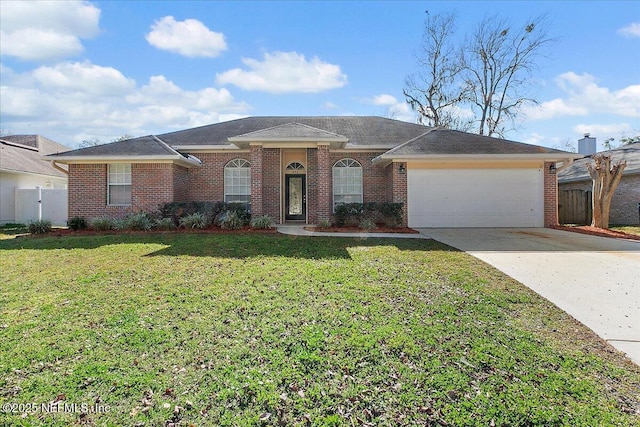 ranch-style home with a garage and a front lawn