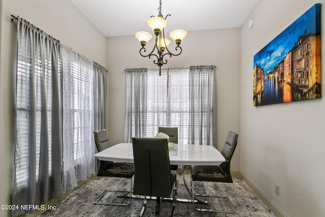 dining area featuring a notable chandelier